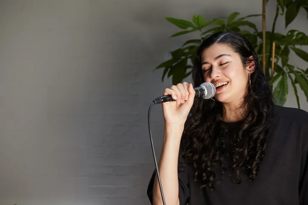 singing into microphone