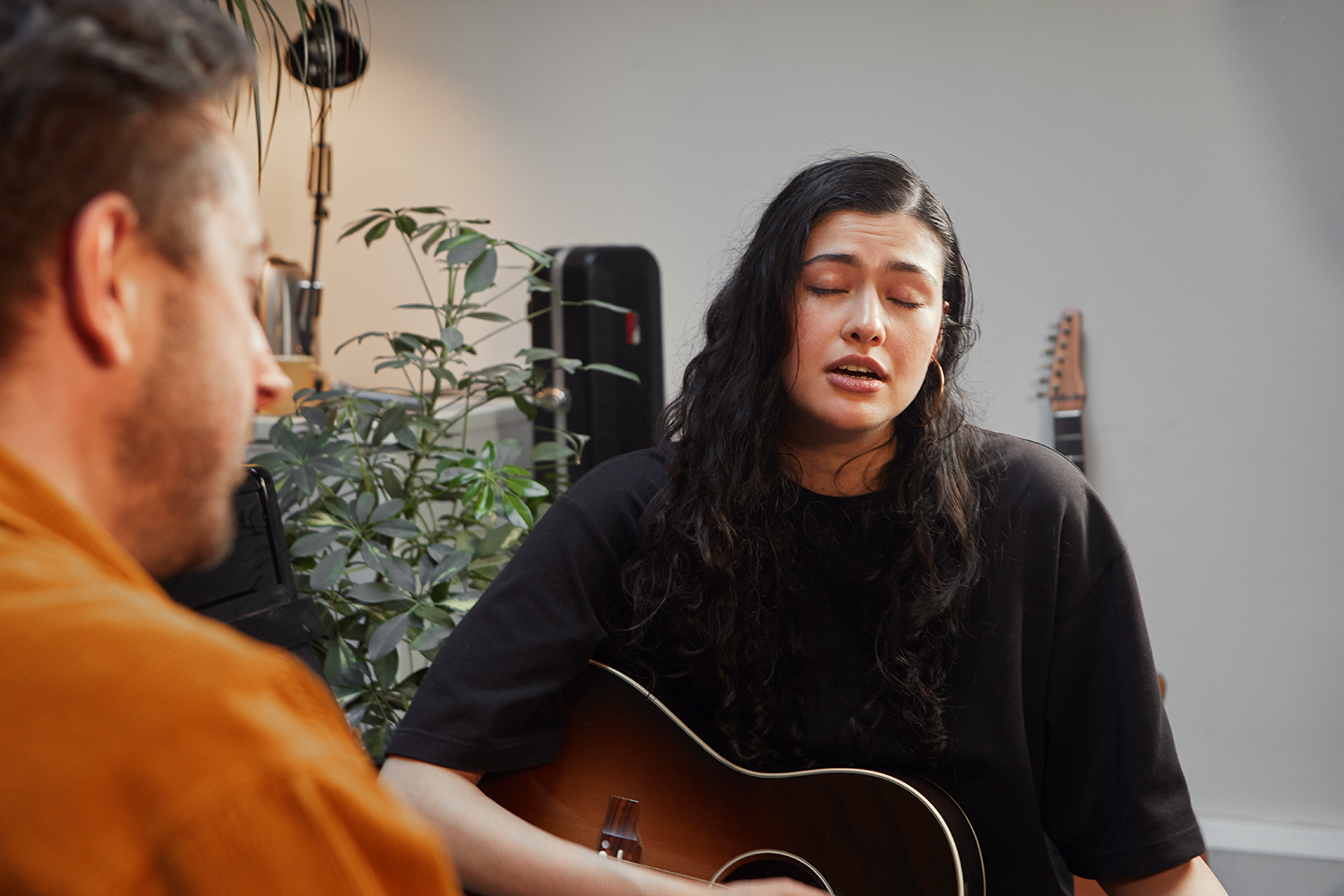 Sam teaching singing to a student in the Hoxton studio