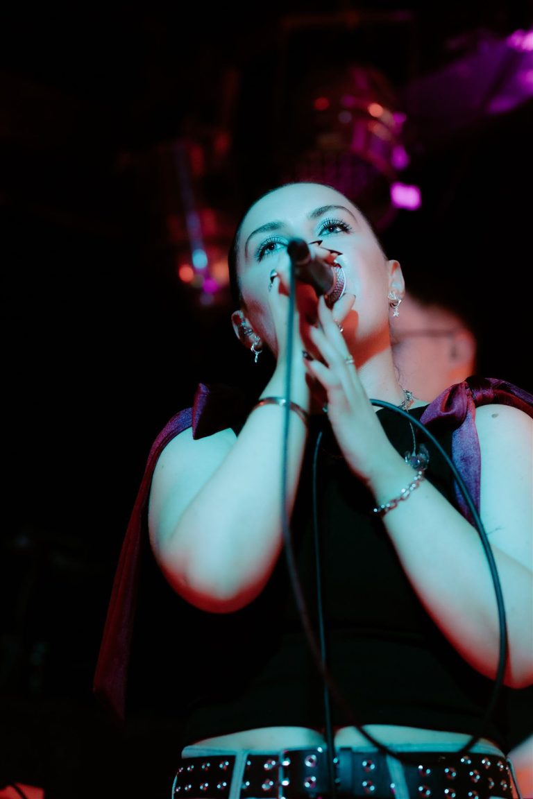 Lou O'Connor performing live on stage, vocal coach and audition specialist at City Vocal Coach
