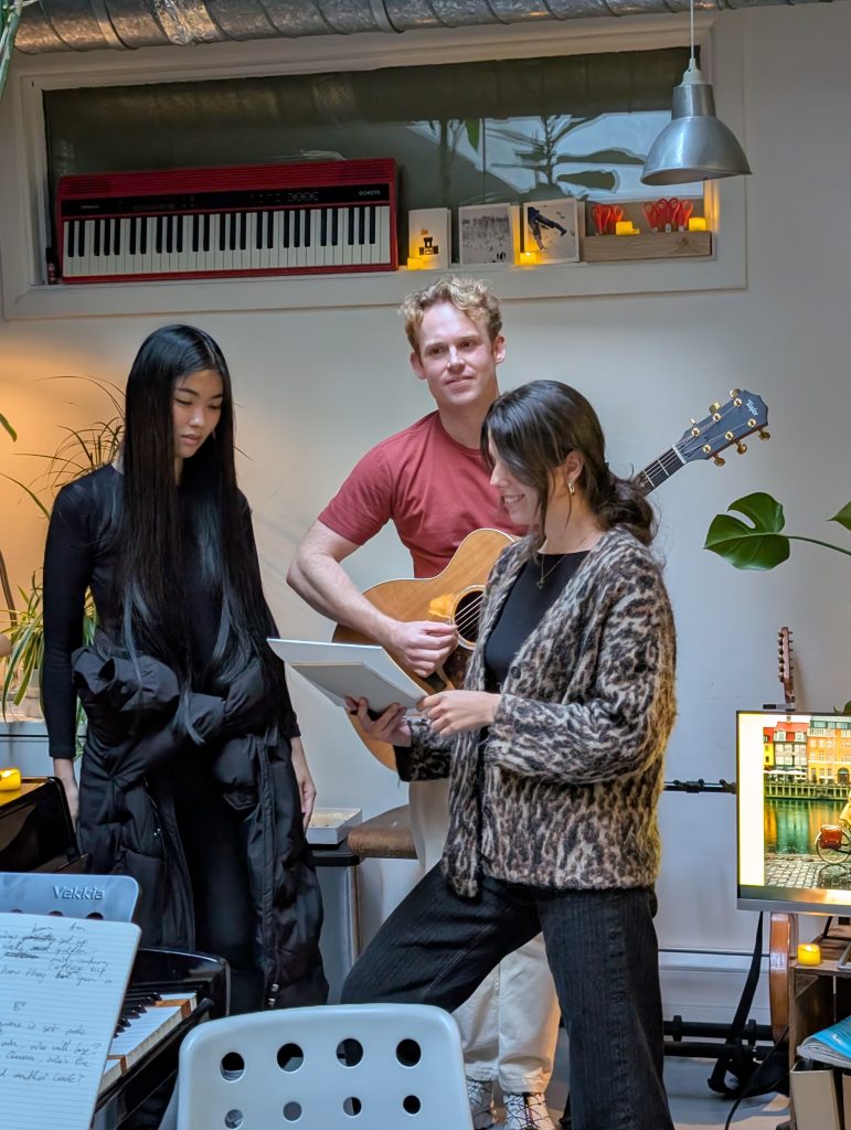Singing students collaborating in the studio